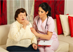 caregiver serving her old patient
